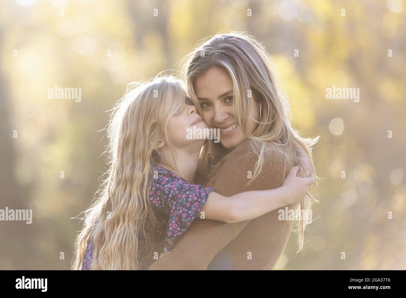 A mother spending quality time with her young daughter, outdoors in a city park; Edmonton, Alberta, Canada Stock Photo