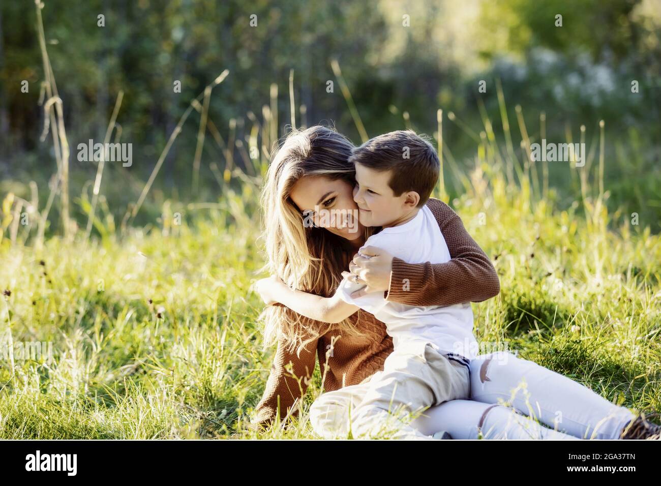 A mother spending quality time with her young son, outdoors in a city park; Edmonton, Alberta, Canada Stock Photo