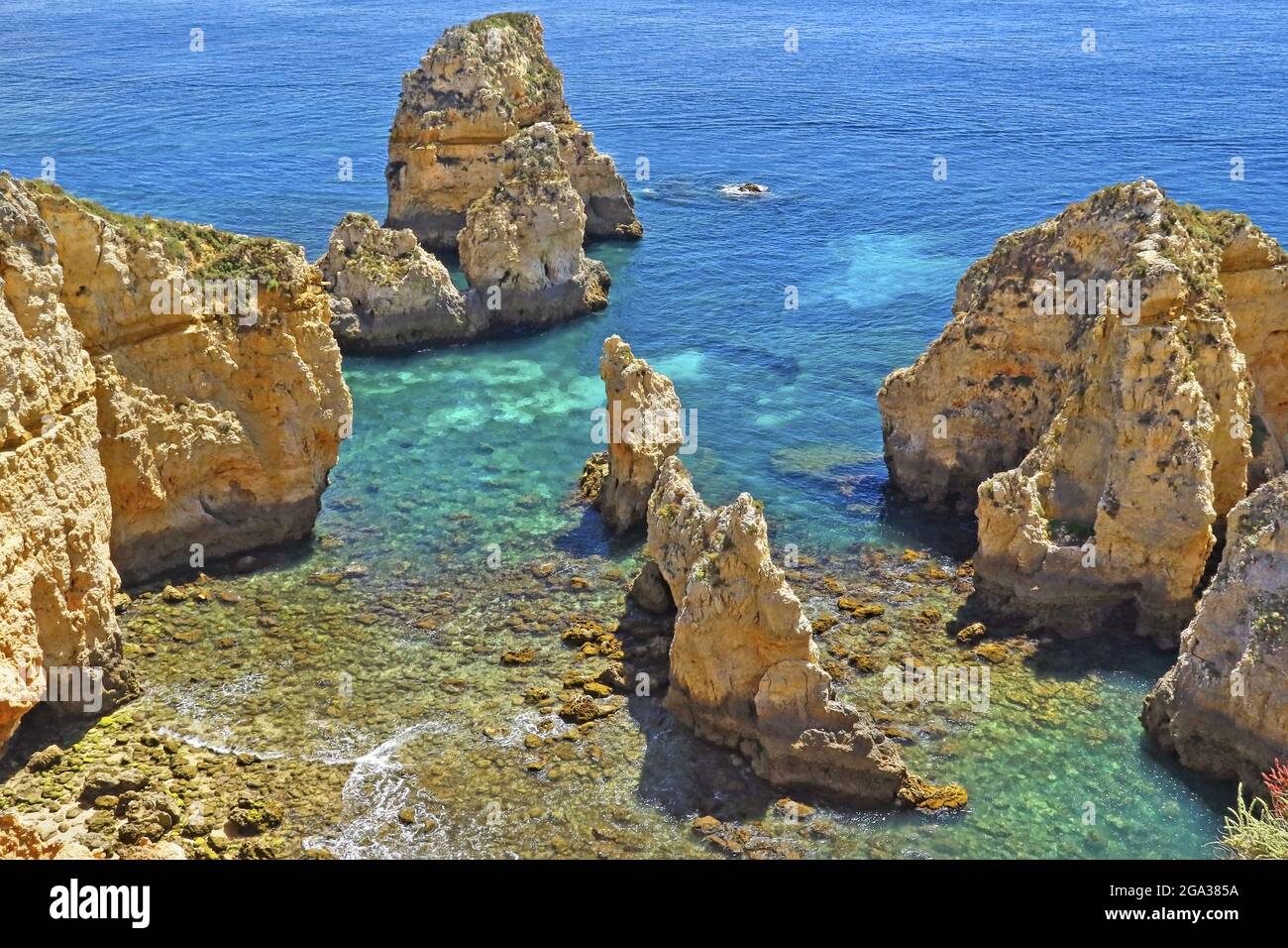 Rugged rock formations along the coast of the Algarve region in Portugal; Portugal Stock Photo