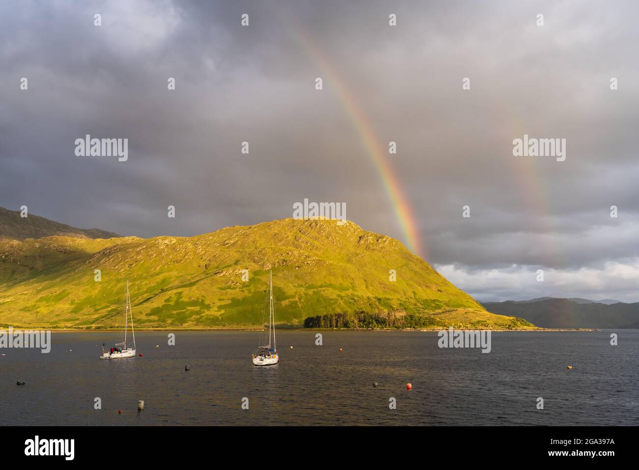 A rainbow spans the sky over Loch Nevis near Inverie, Scotland; Inverie, Scotland Stock Photo