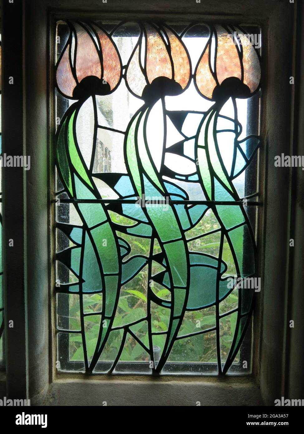 Stylised flowers in a decorative stained glass window at Blackwell