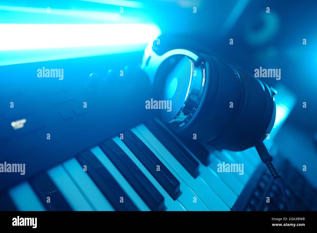 Headphones on the piano keyboard. Recording studio concept Stock Photo