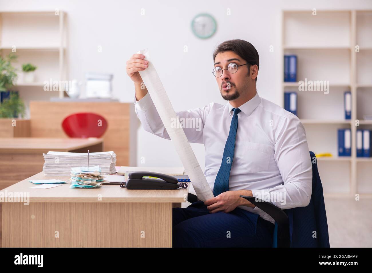 Young bookkeeper in budget planning concept Stock Photo Alamy