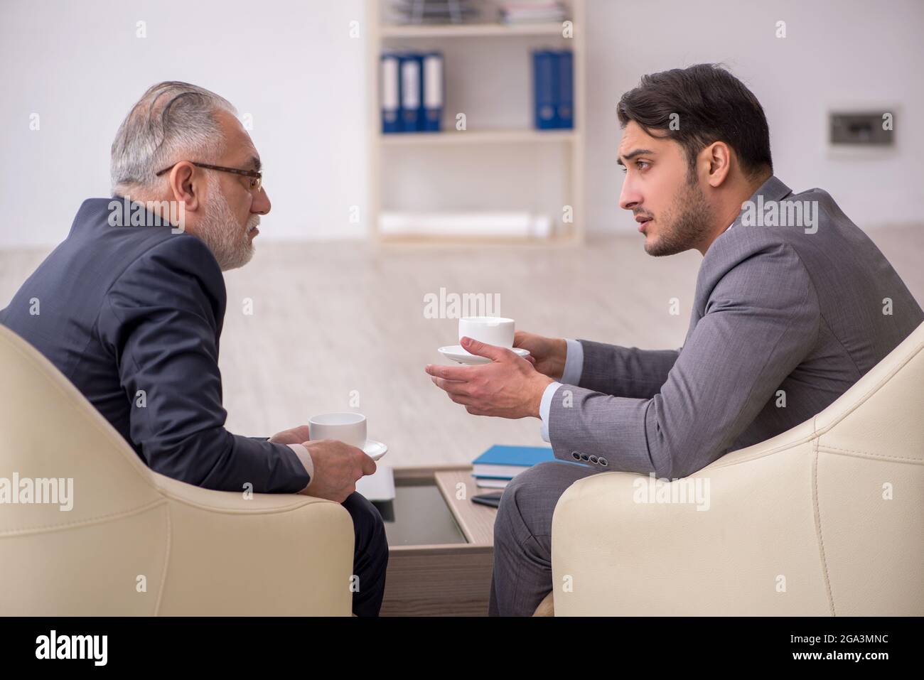 Two businessmen discussing project in the office Stock Photo