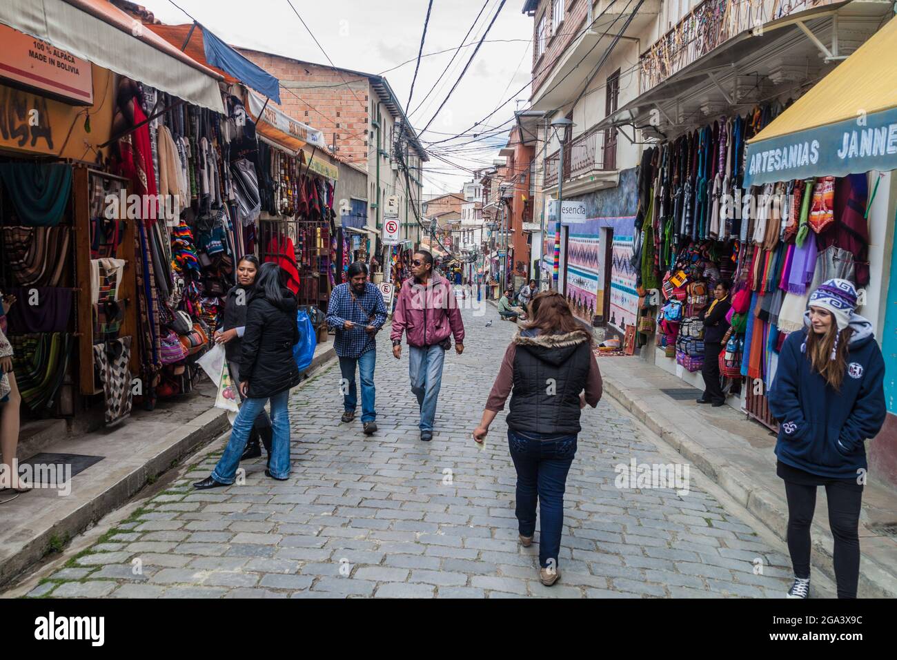 LA PAZ, BOLIVIA - APRIL 28, 2015: People walk a small alley in the center of La Paz, Bolivia. Stock Photo