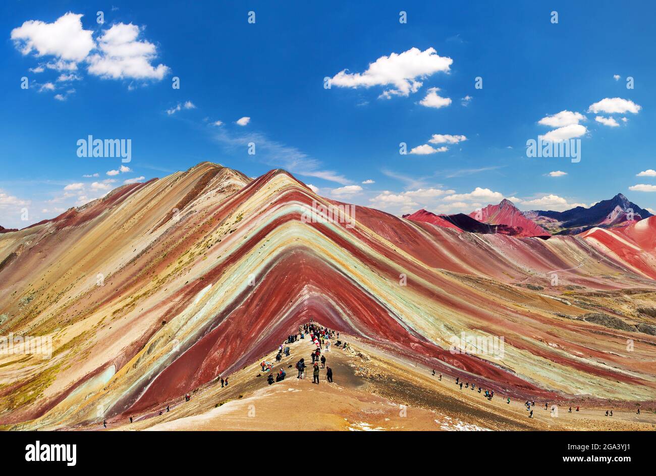 Rainbow mountain or Vinicunca Montana de Siete Colores and beautiful sky, Cuzco or Cusco region in Peru, Peruvian Andes mountains, panoramic view Stock Photo