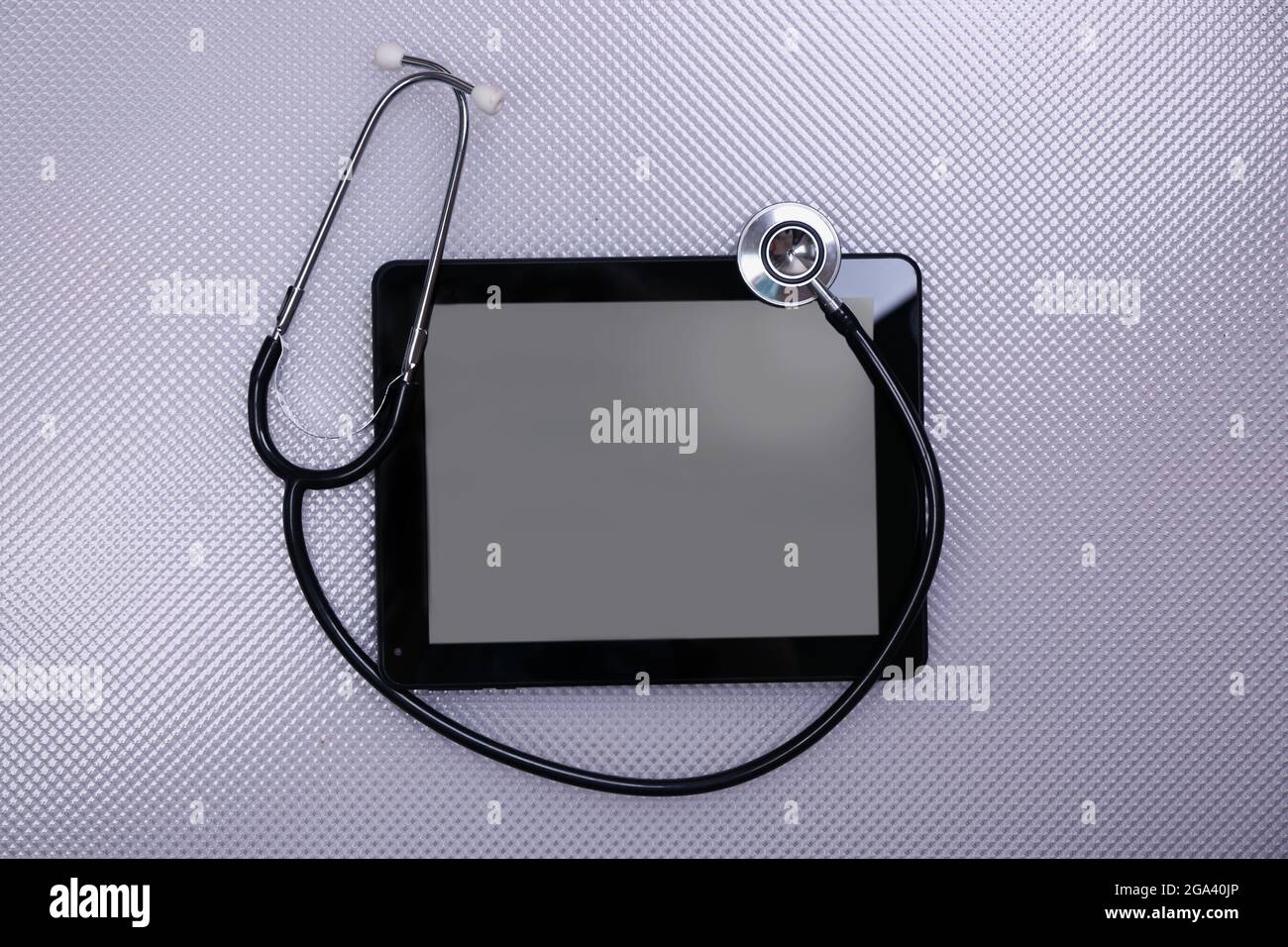 Medical tablet with stethoscope on white background Stock Photo - Alamy