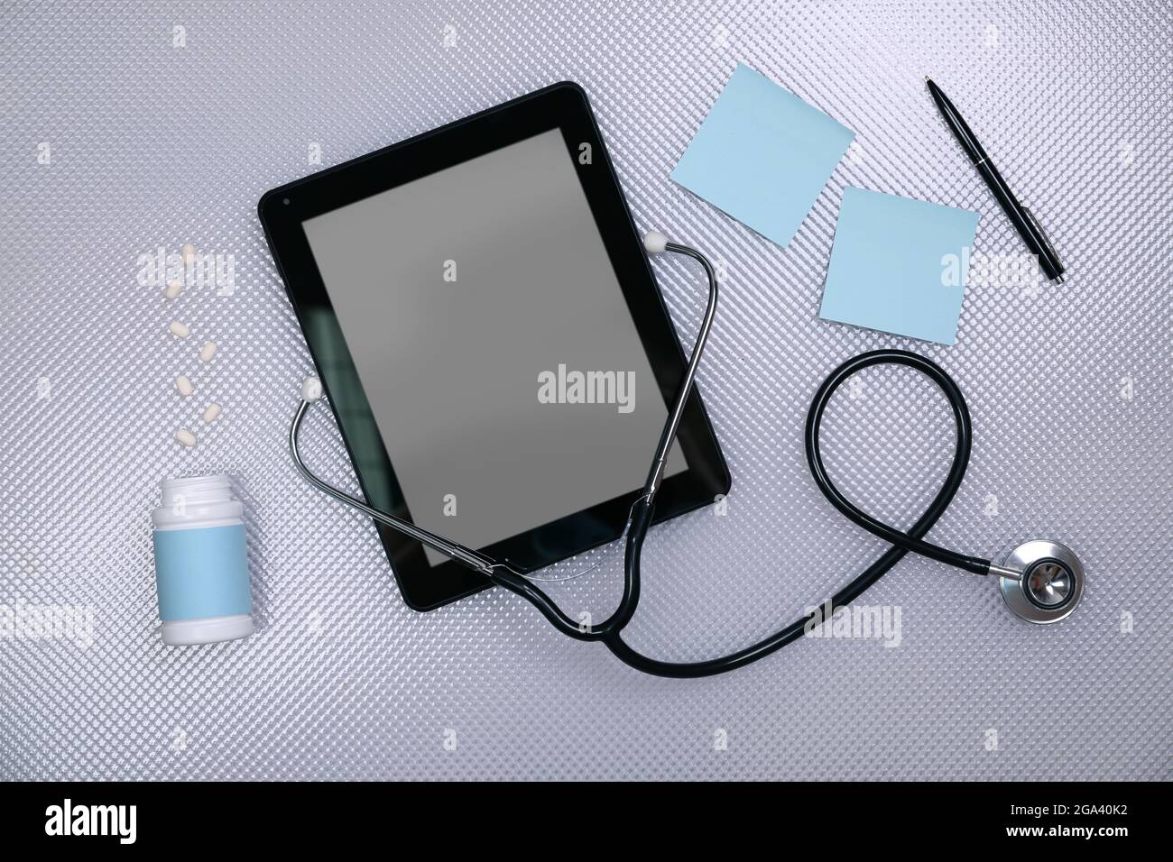 Medical tablet with stethoscope on white background Stock Photo - Alamy