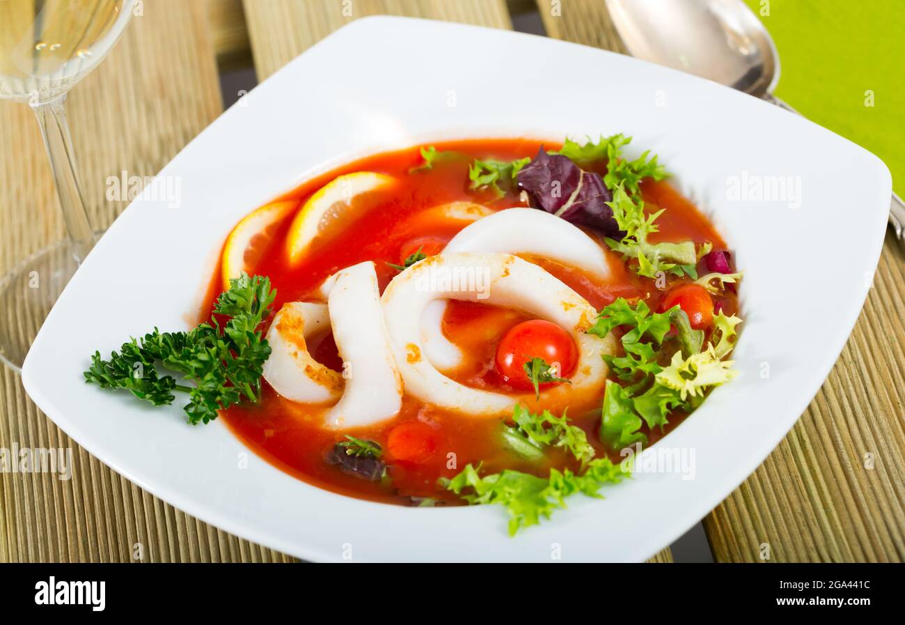 Mediterranean cuisine - tomato soup with squid Stock Photo
