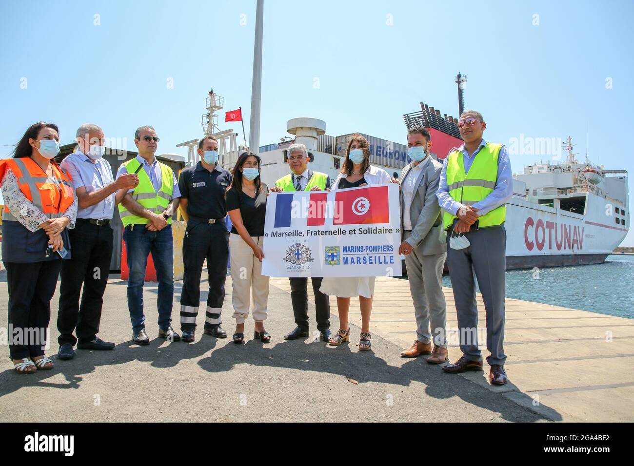 Marseille, France. 28th July, 2021. Elected officials pose for photos at the departure of the equipment. Following the escalation of the covid-19 epidemic in Tunisia, the City of Marseille is sending 225,000 euros of medical equipment to Tunisia intended for Tunisian health structures and front-line health workers who are exposed to the risk of infection. (Photo by Denis Thaust/SOPA Images/Sipa USA) Credit: Sipa USA/Alamy Live News Stock Photo