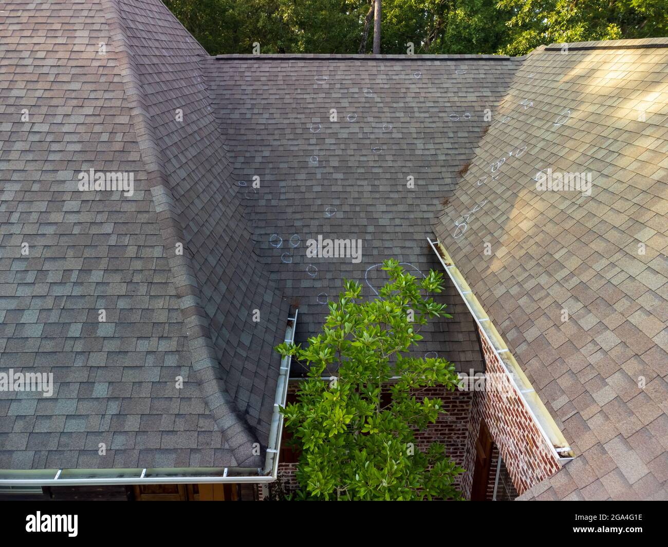 Roo0f with hail damage and chalk markings from inspection Stock Photo