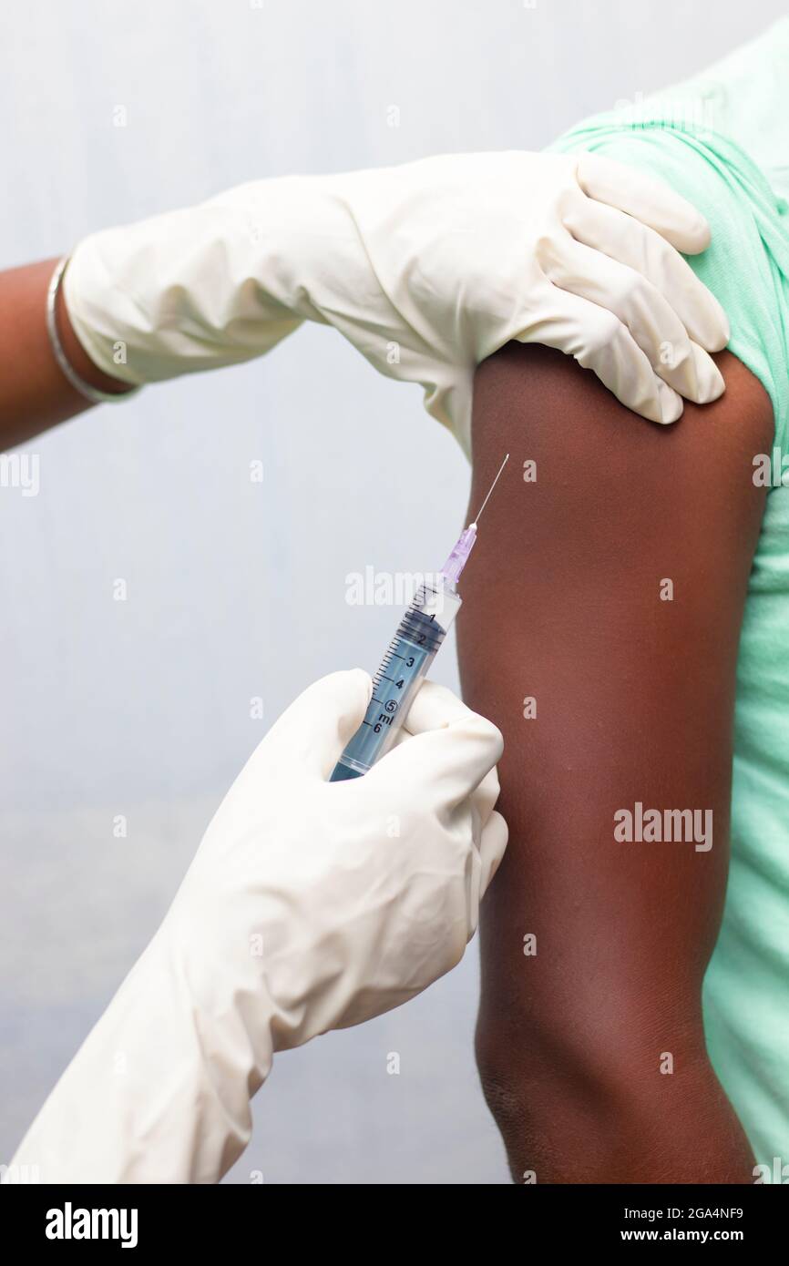 a man is vaccinated by a doctor. Stock Photo