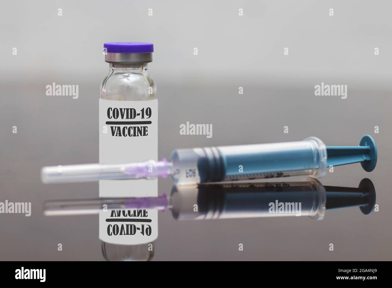 selective focus of covid-19 vaccine with injection syringe. Stock Photo