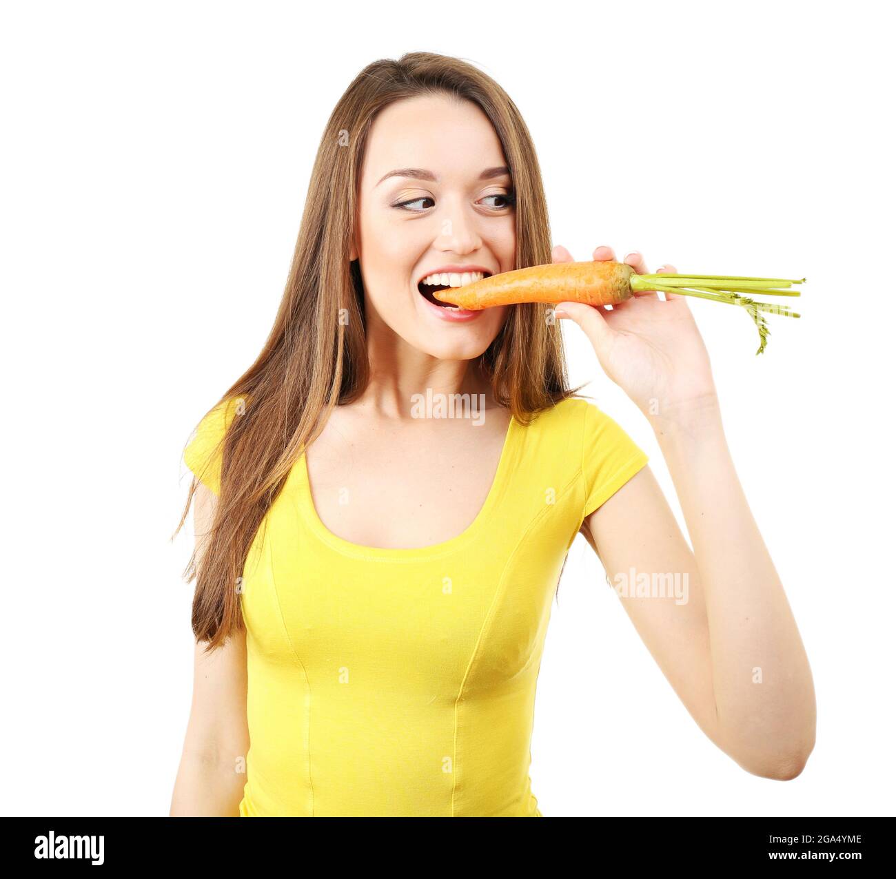 Healthy young woman eating carrot isolated on white Stock Photo Alamy