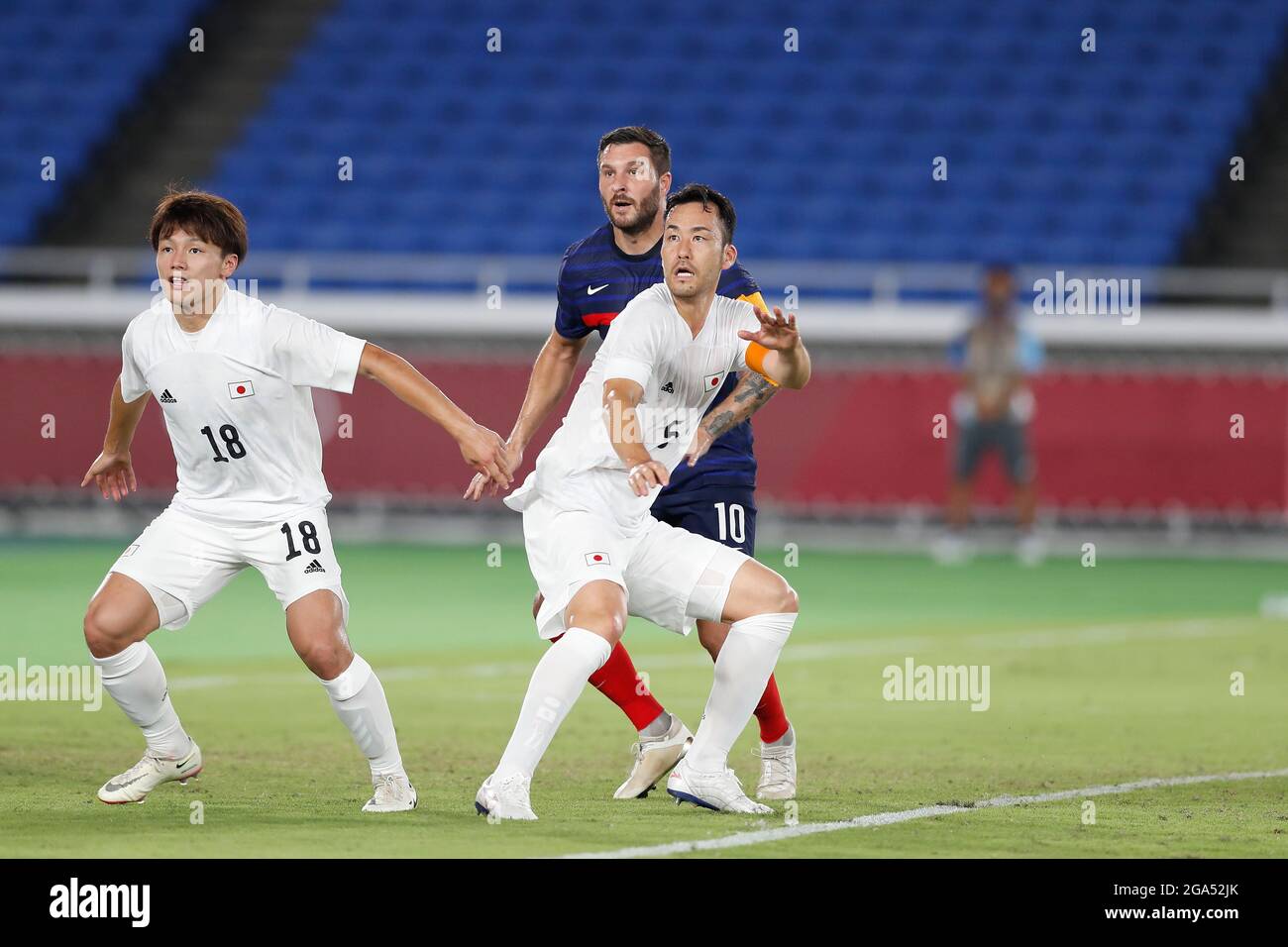 Yokohama, Japan. 28th July, 2021. (L-R) Ayase Ueda, Andre-Pierre Gignac (FRA), Maya Yoshida (JPN) Football/Soccer : Tokyo 2020 Olympic Games Men's football 1st round group A match between France 0-4 Japan at the International Stadium Yokohama in Yokohama, Japan . Credit: Mutsu Kawamori/AFLO/Alamy Live News Stock Photo