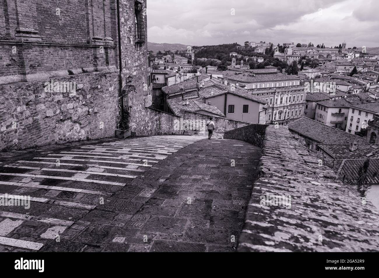 Black and White image of a descending path and houses in Perugia Italy Stock Photo