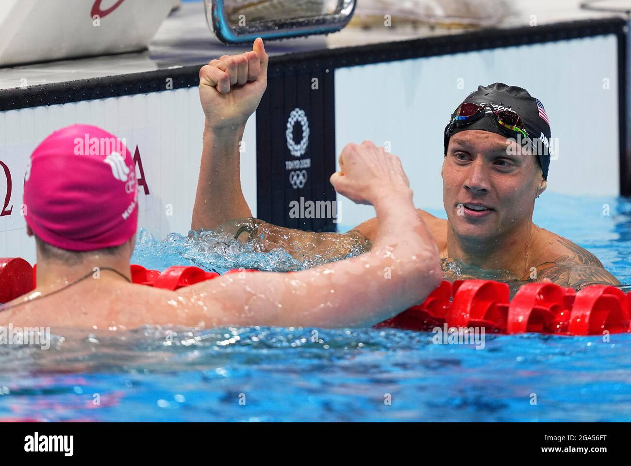 Tokyo, Japan. 29th July, 2021. Caeleb Dressel of the United States (R) and Kliment Kolesnikov of Russian Olympic Committee (ROC) salute each other after the men's 100m freestyle final of swimming at Tokyo 2020 Olympic Games in Tokyo, Japan, July 29, 2021. Credit: Xu Chang/Xinhua/Alamy Live News Stock Photo