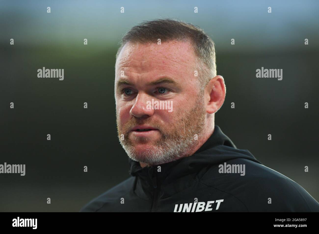 DERBY, UK. JULY 28TH Wayne Rooney, manager of Derby County gets interviewed by the waiting media during the Pre-season Friendly match between Derby County and Real Betis Balompi at the Pride Park, Derby on Wednesday 28th July 2021. (Credit: Jon Hobley | MI News) Credit: MI News & Sport /Alamy Live News Stock Photo