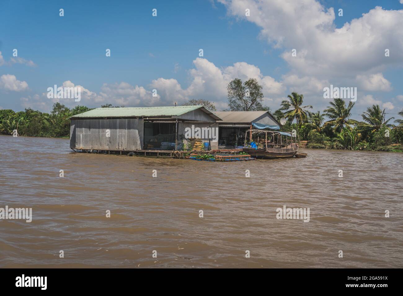 Floating house on the Mekong River in Vietnam, South East Asia. Vung