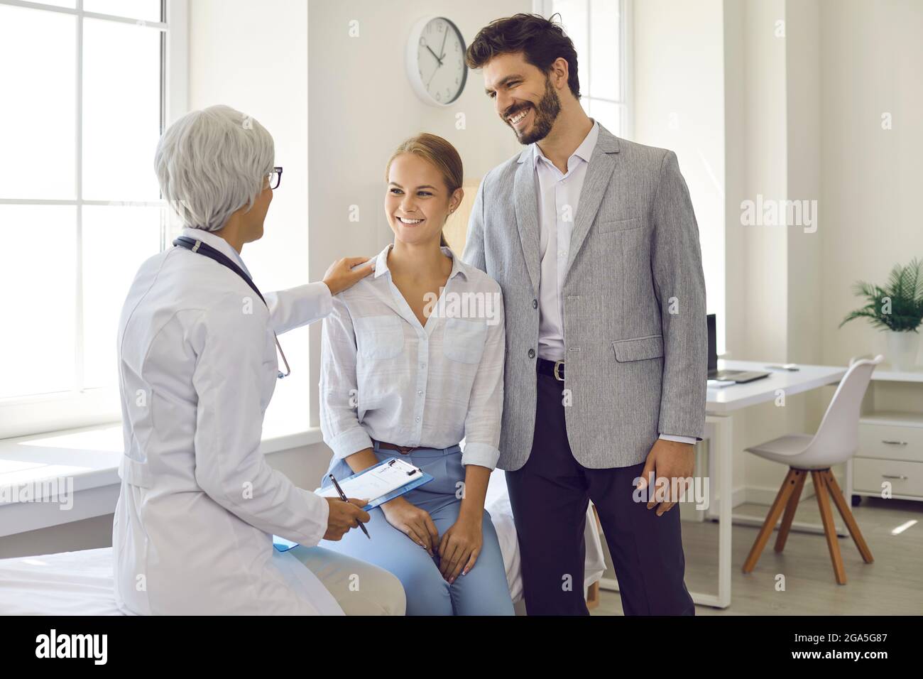 Happy Young Husband And Wife Planning Pregnancy And Seeing Family