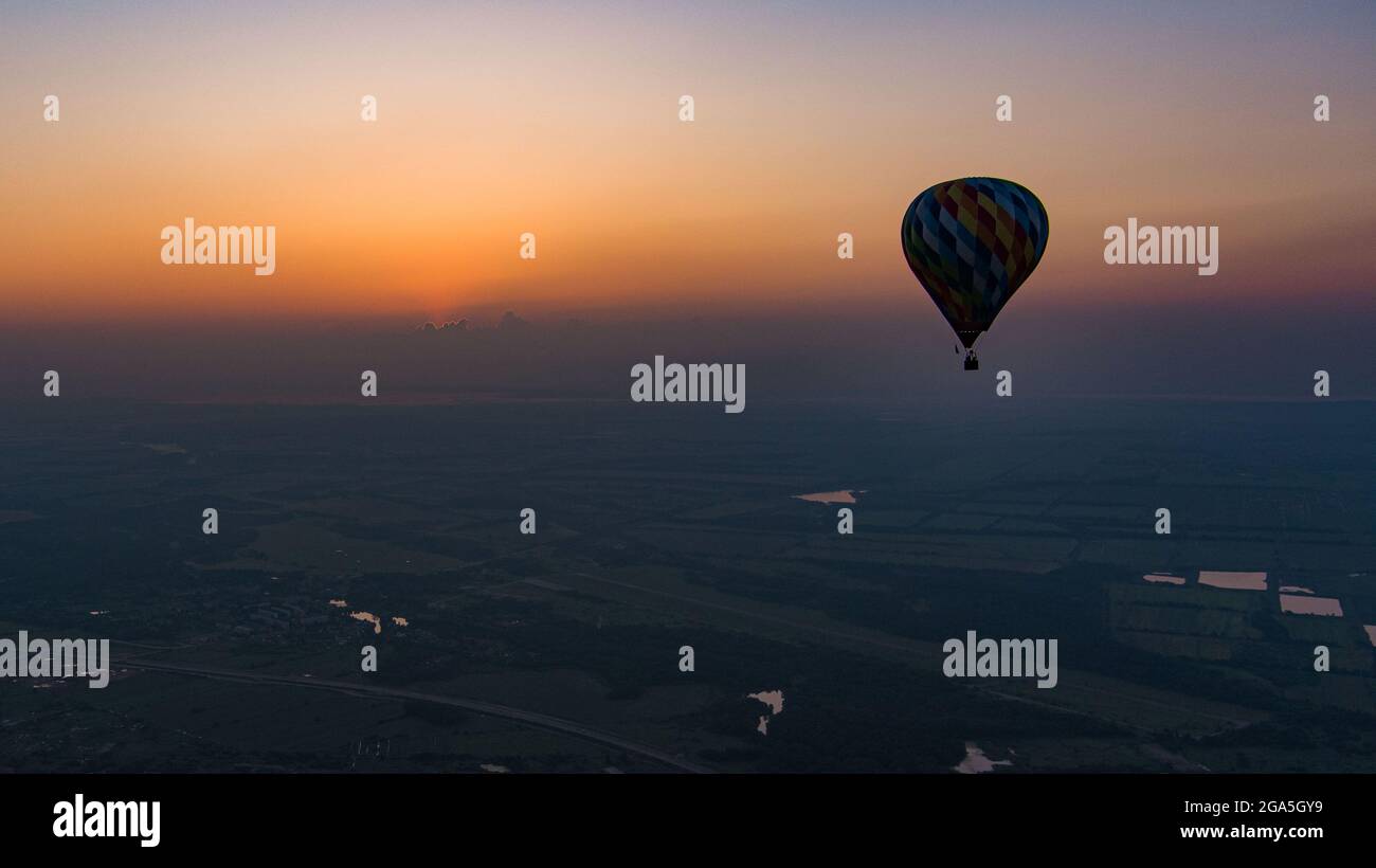 color hot air balloon in sky cloud and sunrise background at the ...