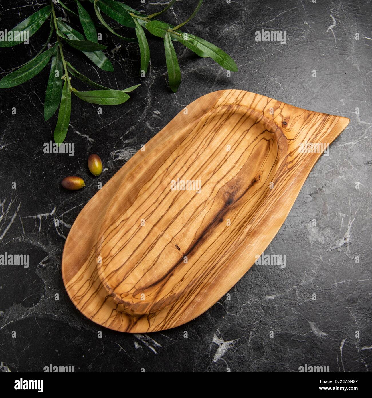 hand crafted olive wood plate Stock Photo Alamy