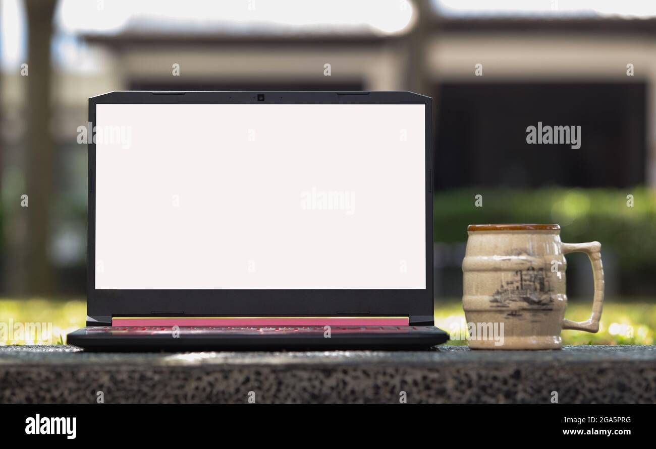 Laptop with blank screen on the Table Stock Photo