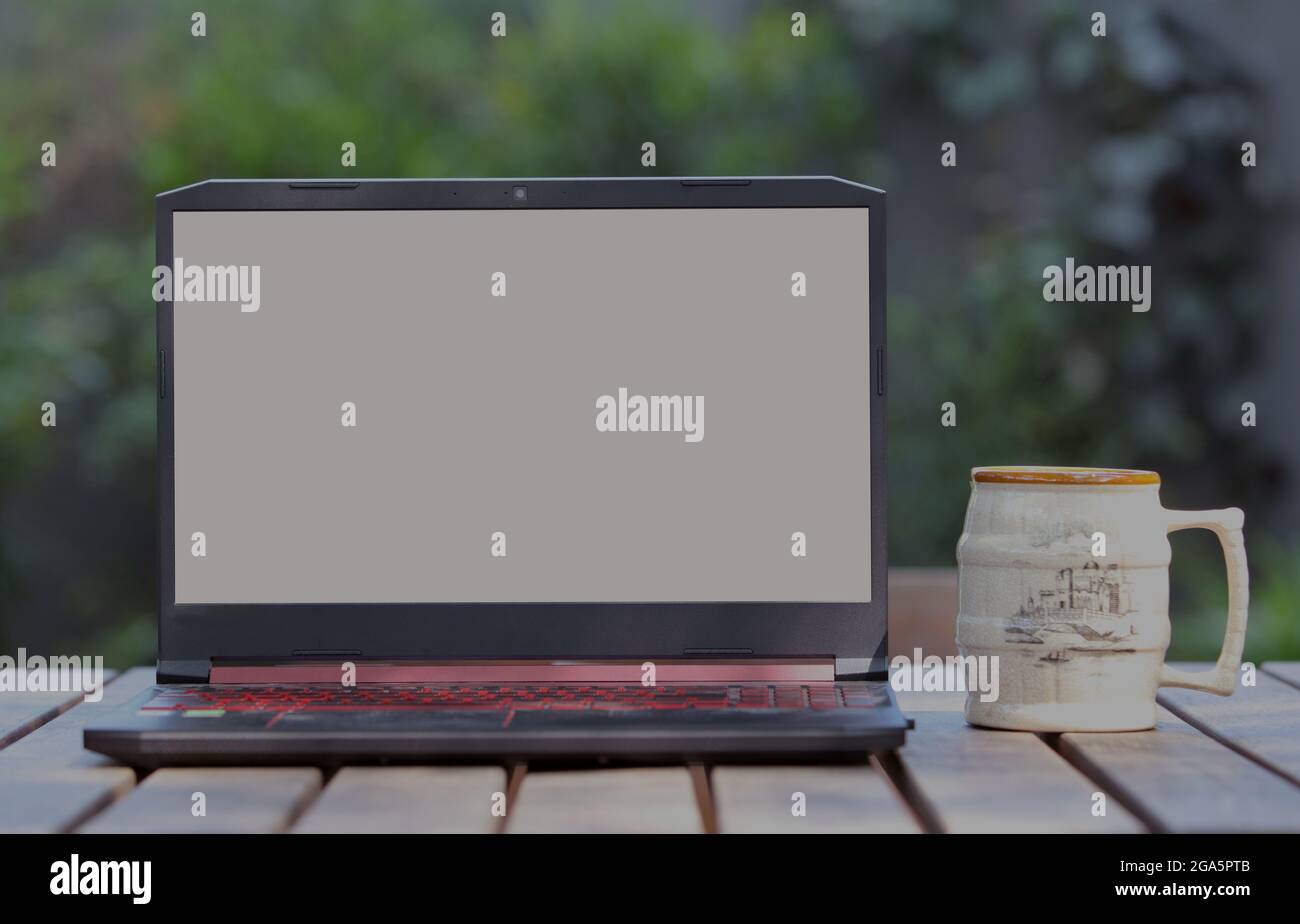 Laptop with blank screen on the Table Stock Photo