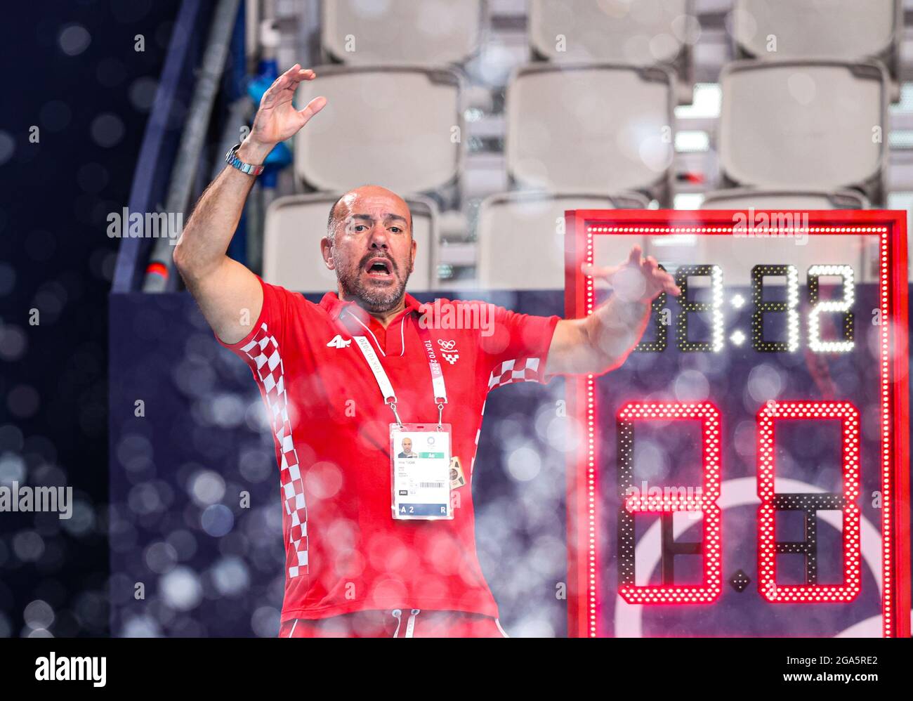 Tokyo, Japan. 29th July, 2021. Croatia's head coach Ivica Tucak reacts during the men's preliminary round match of Water Polo between Croatia and Montenegro at the Tokyo 2020 Olympic Games in Tokyo, Japan, on July 29, 2021. Credit: Wang Jingqiang/Xinhua/Alamy Live News Stock Photo