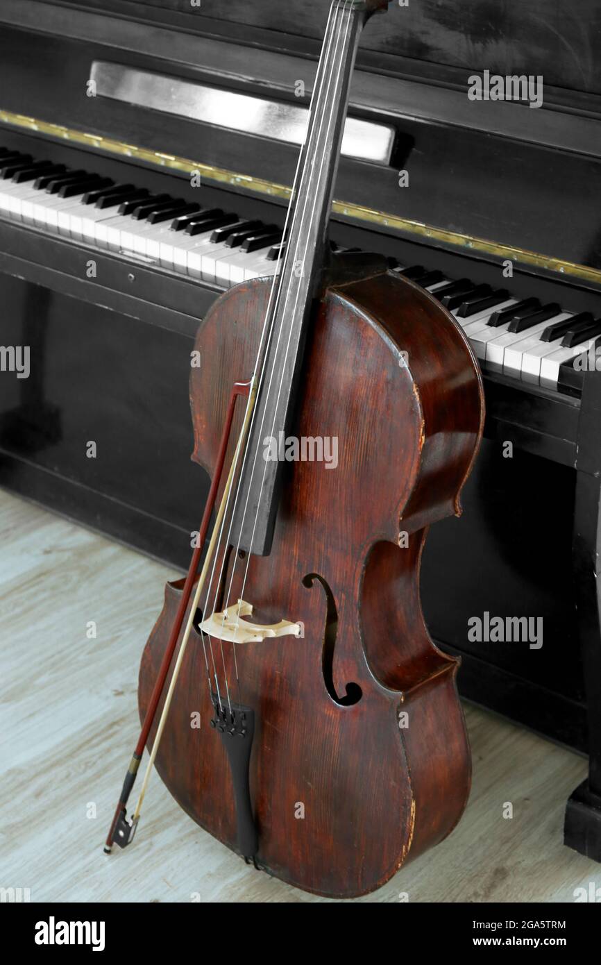 Cello near piano, indoors Stock Photo Alamy