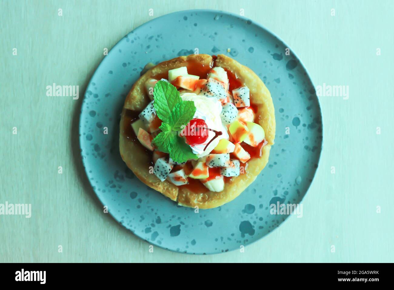 naan or roti, deep fried naan with fruit and ice cream topping Stock