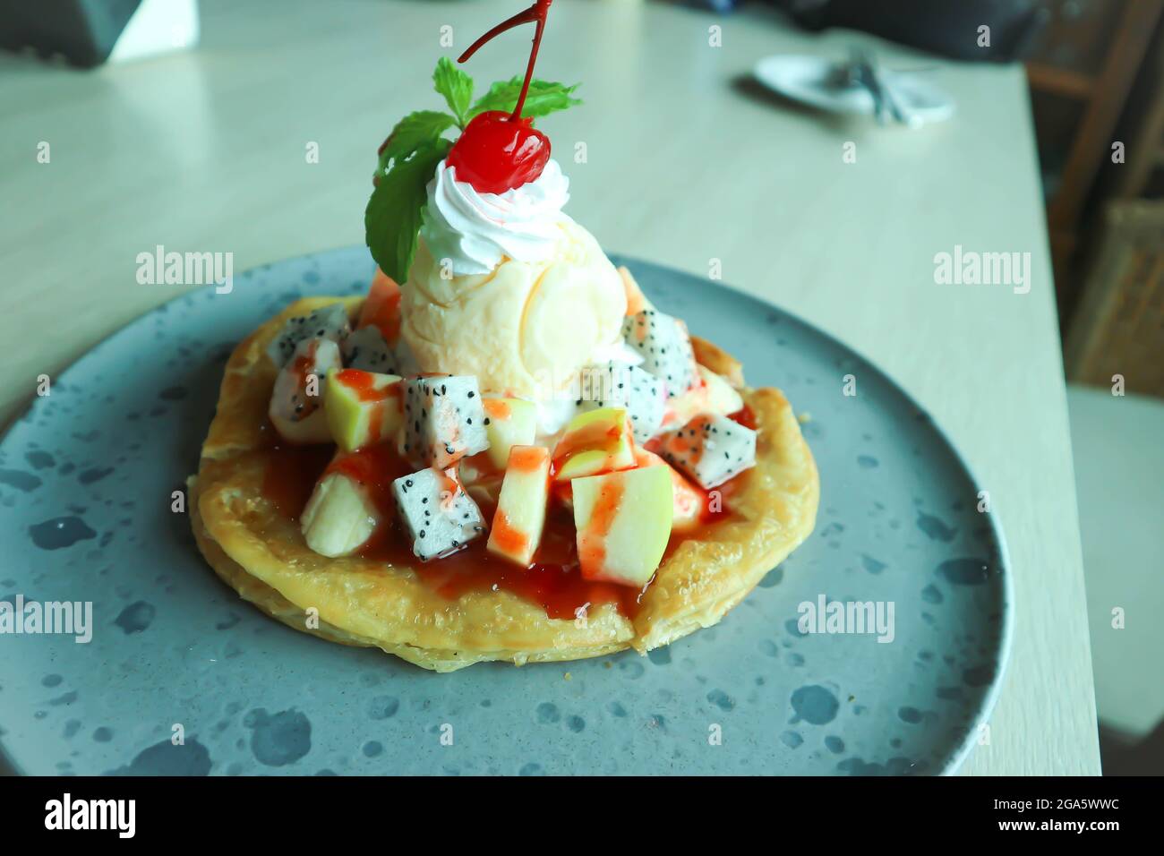 naan or roti, deep fried naan with fruit and ice cream topping Stock