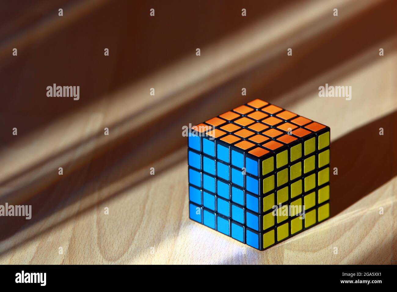 Colorful cube on wood background Stock Photo