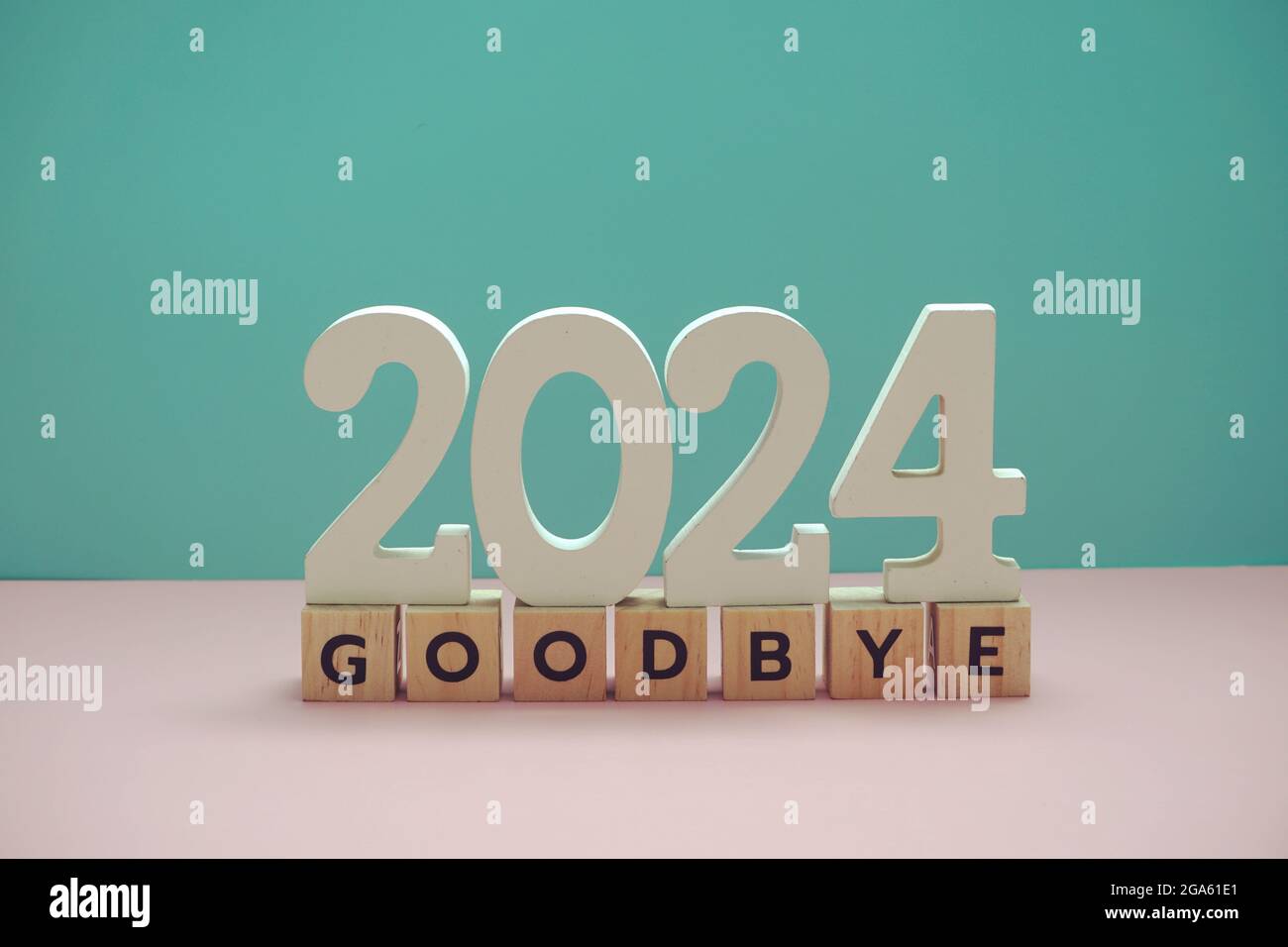 Goodbye 2024 alphabet letter on blue and pink background Stock Photo