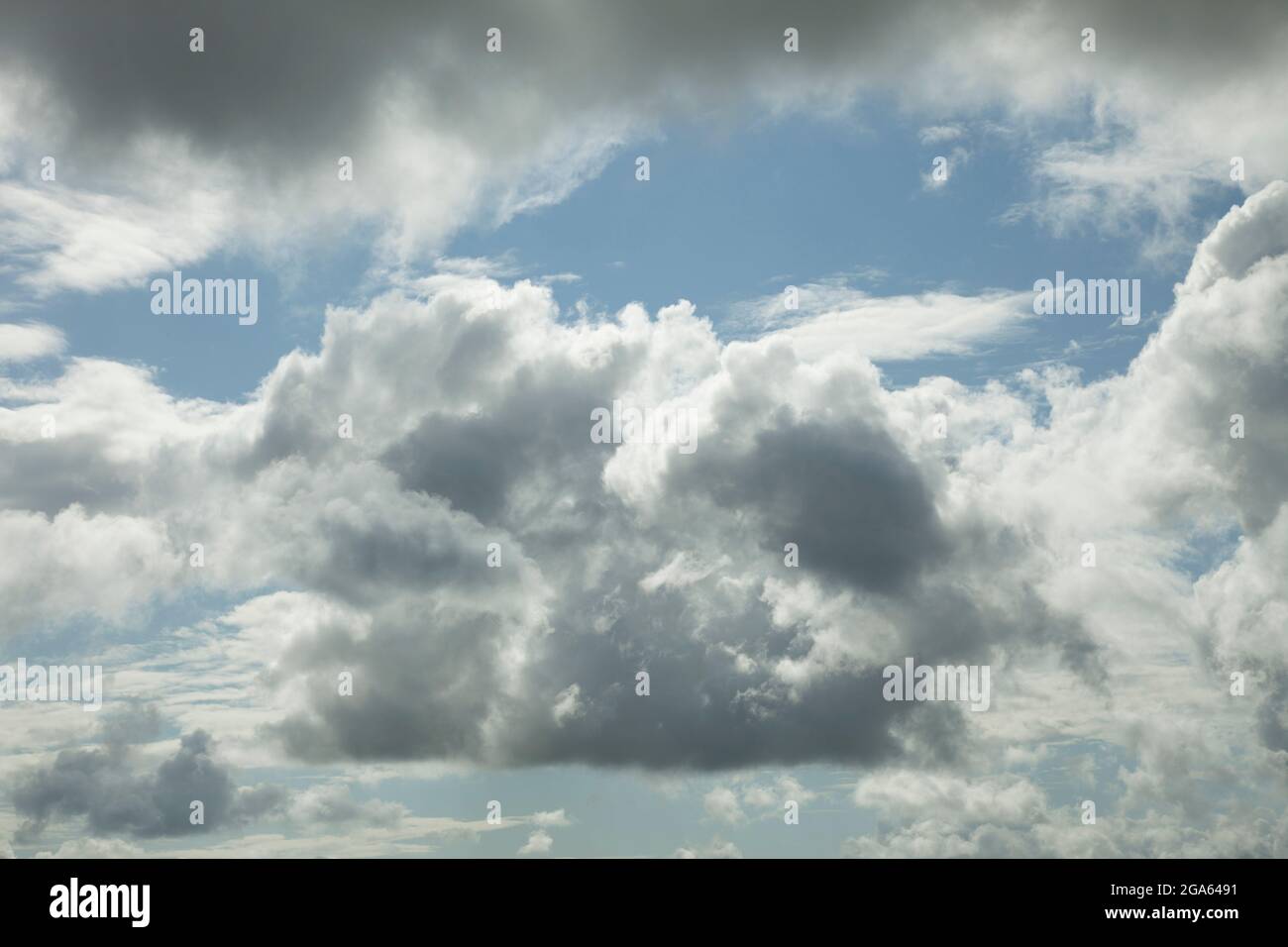 Cumulus clouds seen against a blue sky (These are Cumulus mediocris, being as wide as they are tall) Stock Photo