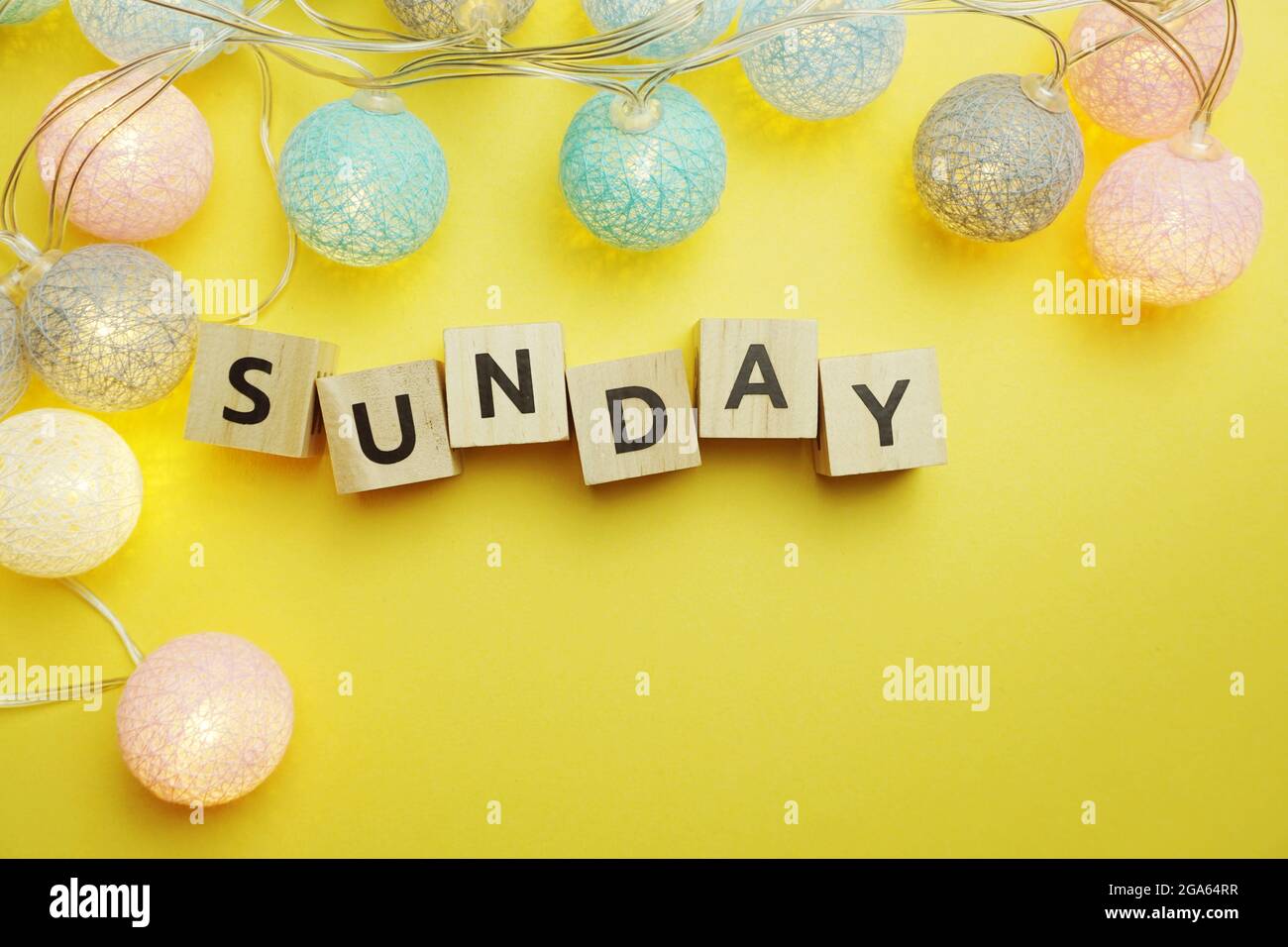 Sunday alphabet letters with LED cotton balls decoration on yellow ...