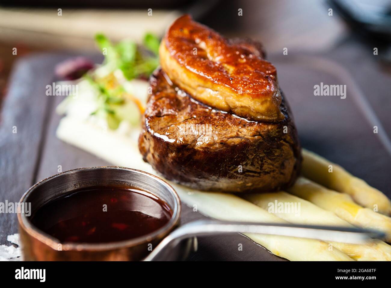 Tournedos Rossini. Foie gras, Black Angus beef tenderloin, white asparagus,  red wine sauce. Delicious healthy traditional food closeup served for lunc  Stock Photo - Alamy