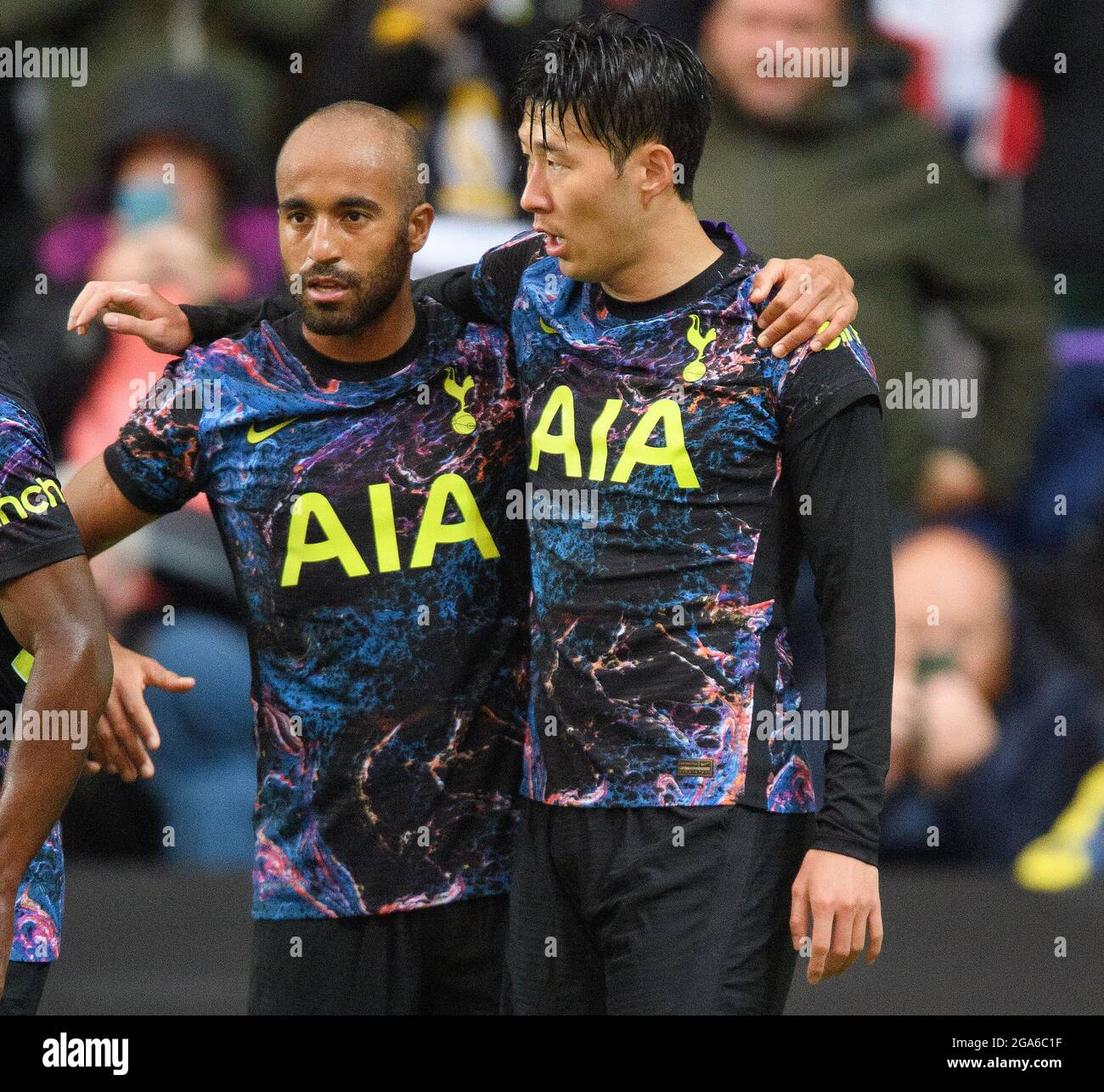 Heung-Min Son celebrates scoring with Lucas Moura during the pre season friendly match at Stadium Stock Photo