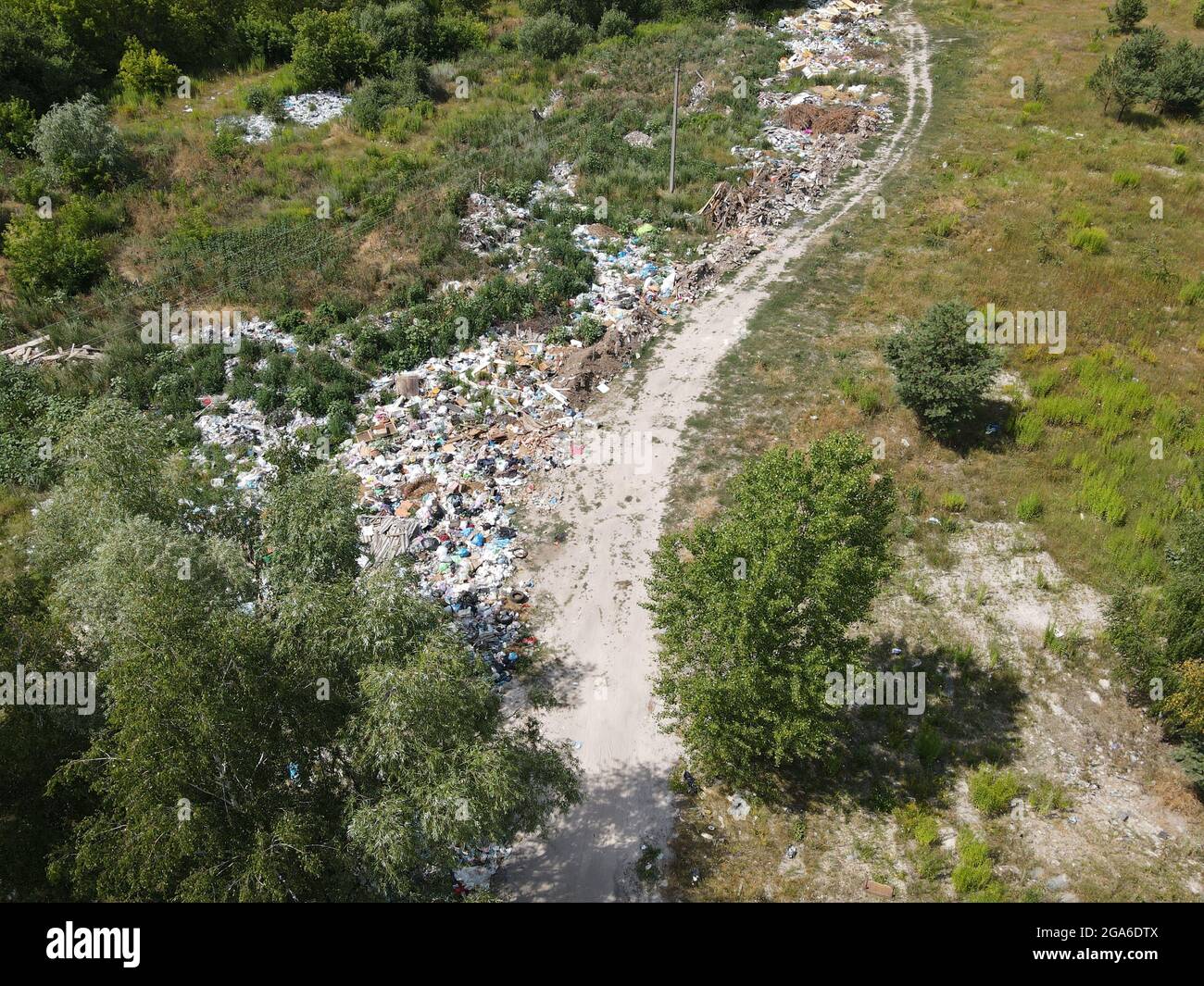 Junkyard, pollution in a forest near road Stock Photo Alamy
