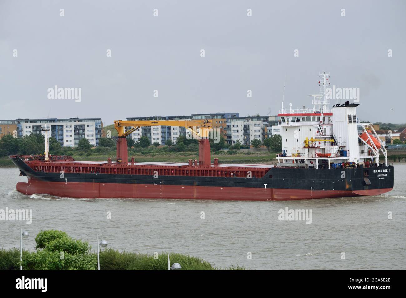 Cargo ship BULKER BEE 11 departing London after unloading a cargo of cane sugar at Tate & Lyle Sugar's Thames Refinery at Silvertown Stock Photo