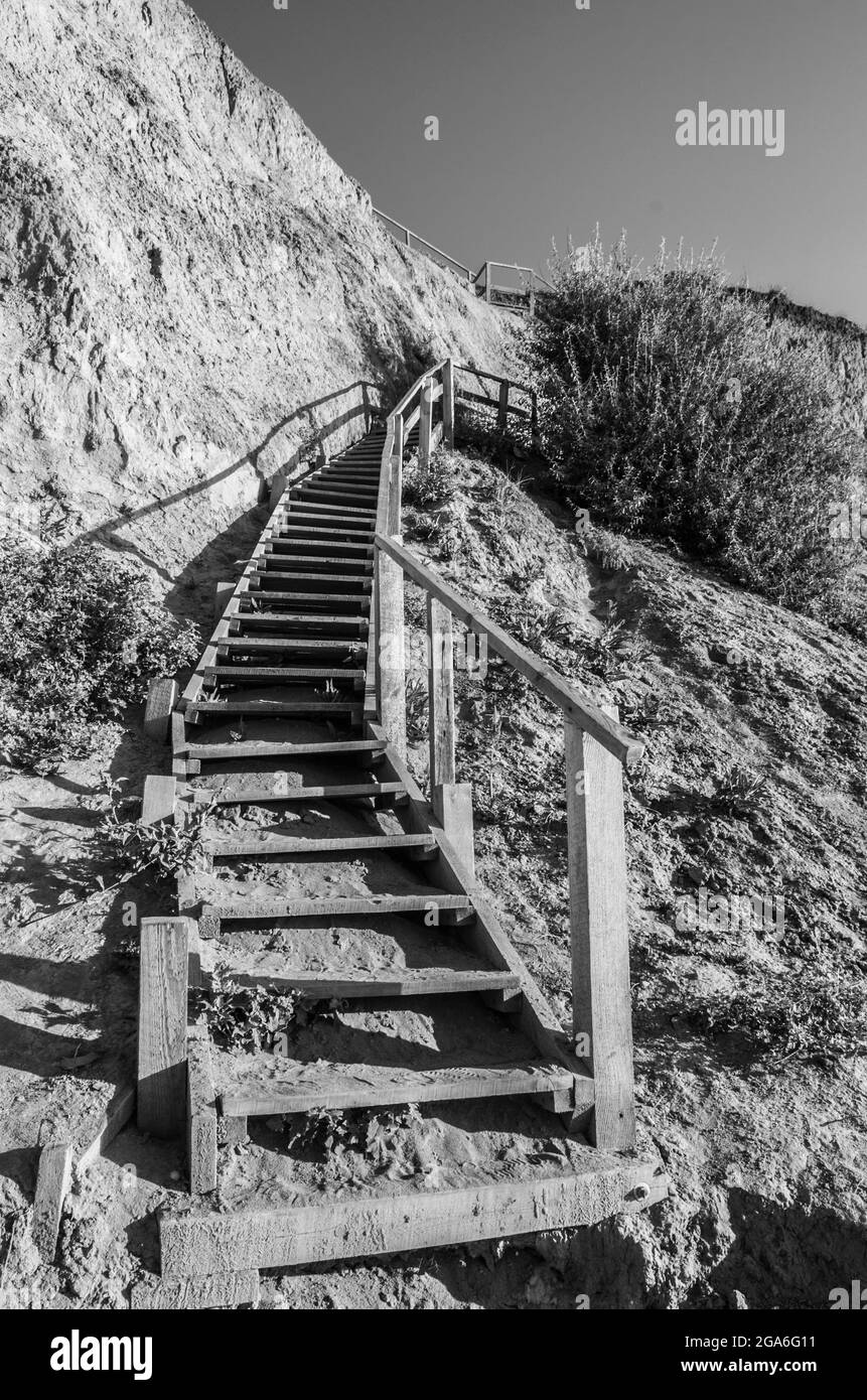 Landscape of wooden stairs to the sea. Black and white concept photo. Stock Photo