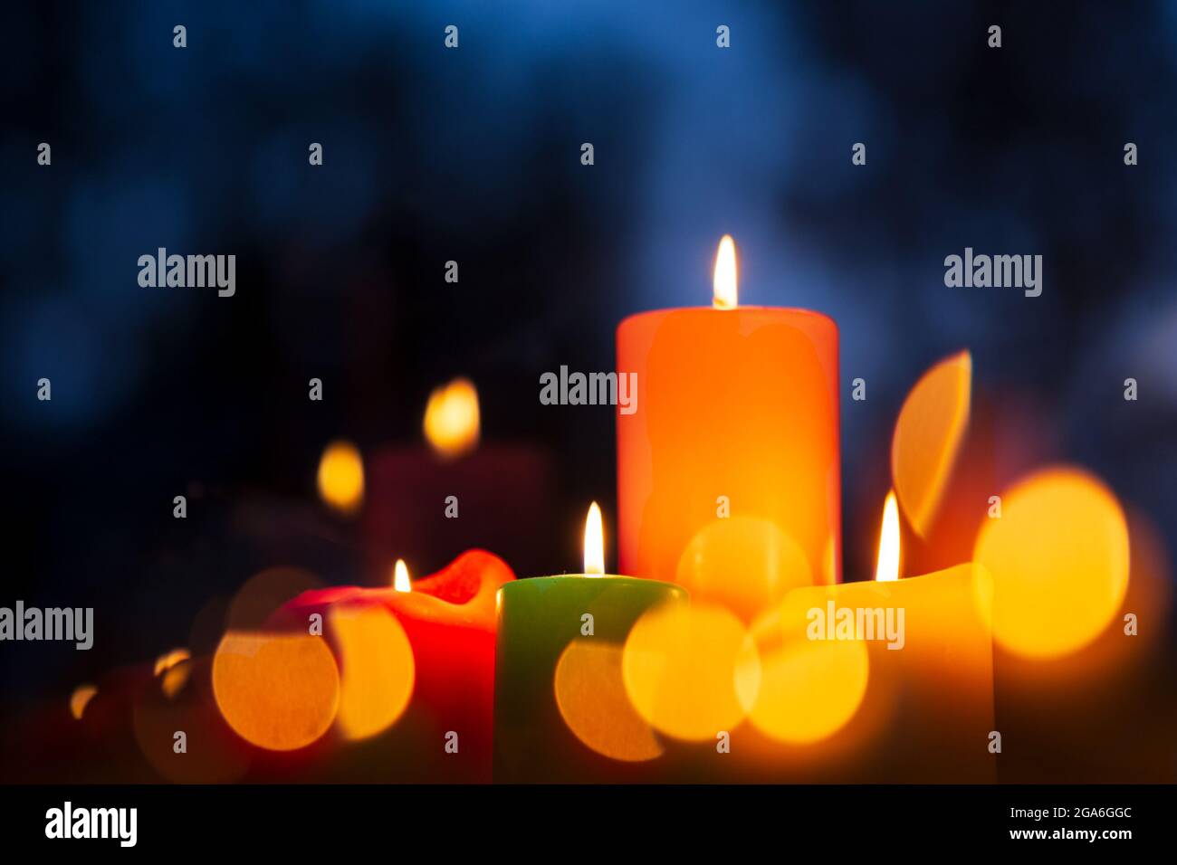 Candle lights in the evening, reflections in the window Stock Photo Alamy