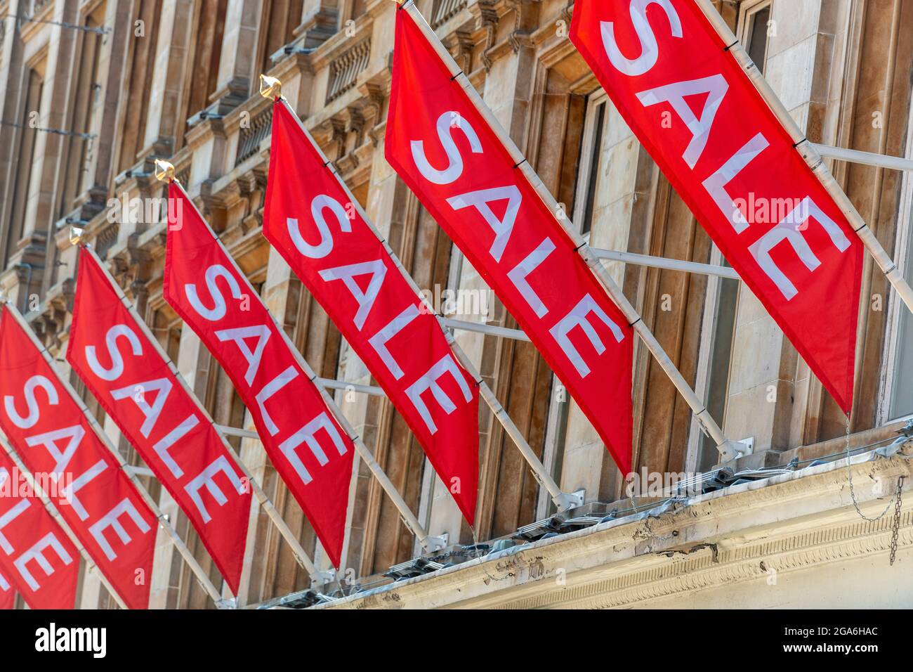 sale flags and signs outside of a major high street retailer store