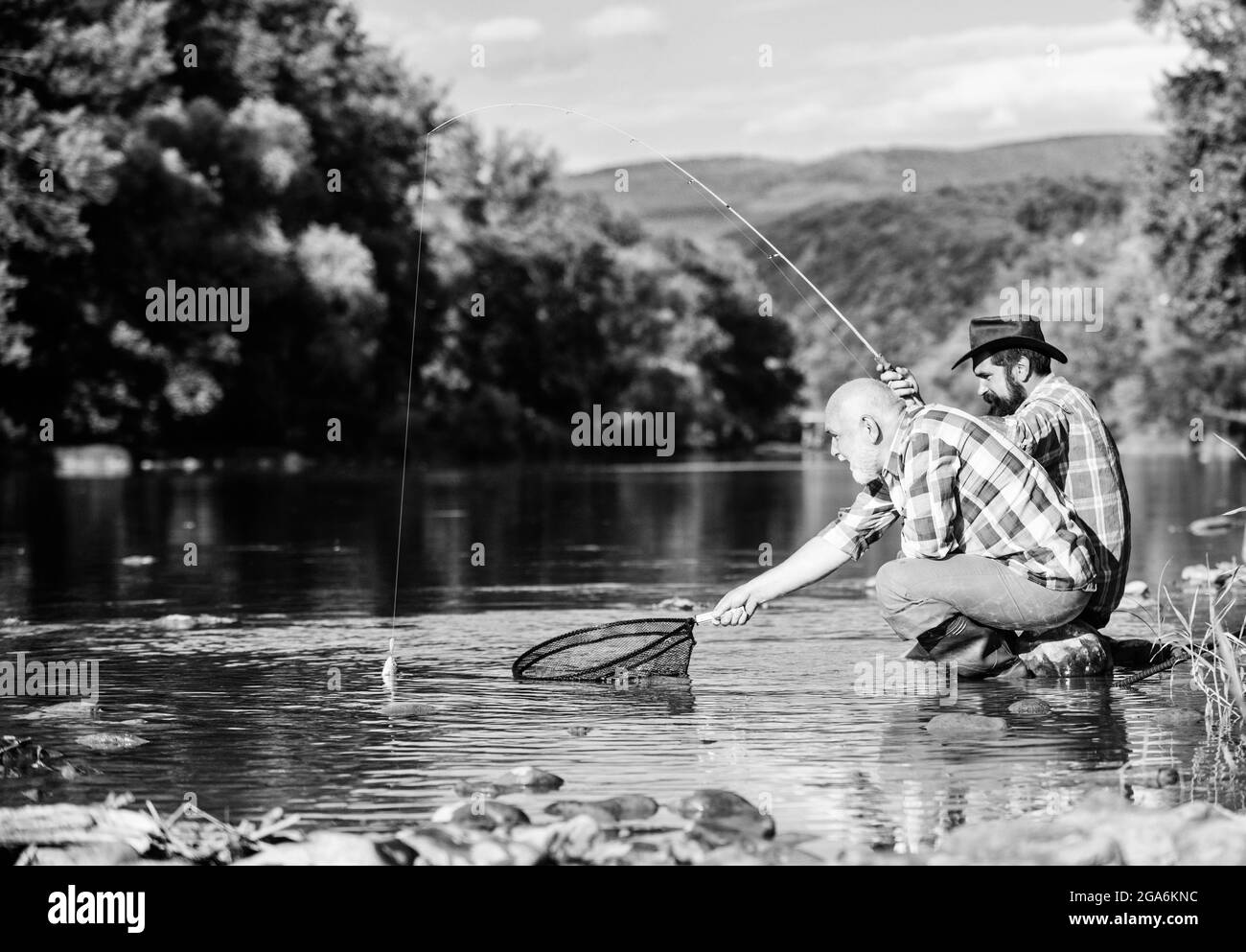 We have caught it. kids spend time in camp. having fun. fish angler. two  girls fishing. Big game fishing. summer hobby. happy children with net and  rod. summer holidays weekend. Fly Fishing
