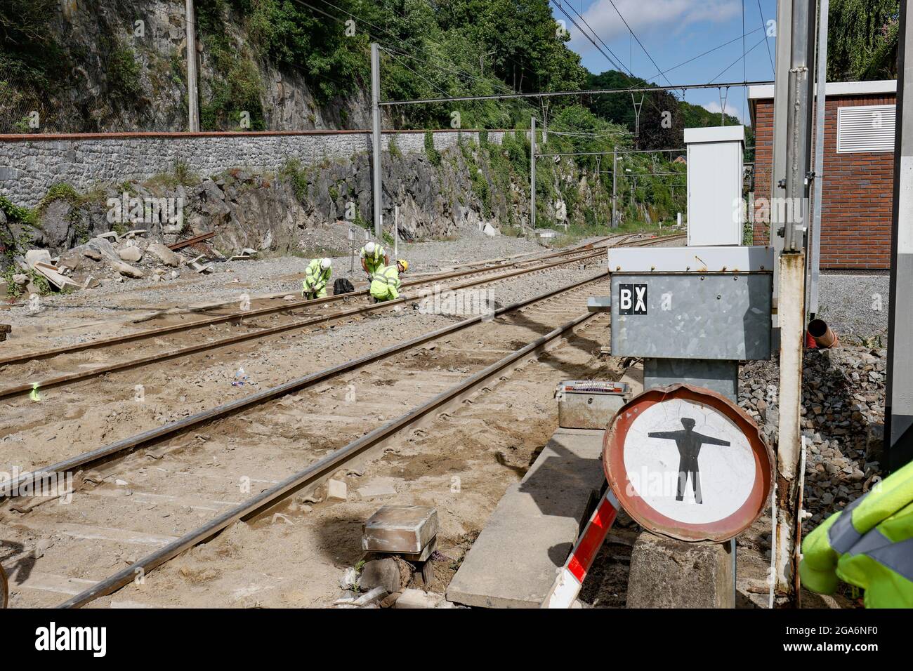 Illustration picture shows workers at the level crossing in the Rue Andre Sodar that was destroyed following a mud flood after heavy rains, during a v Stock Photo