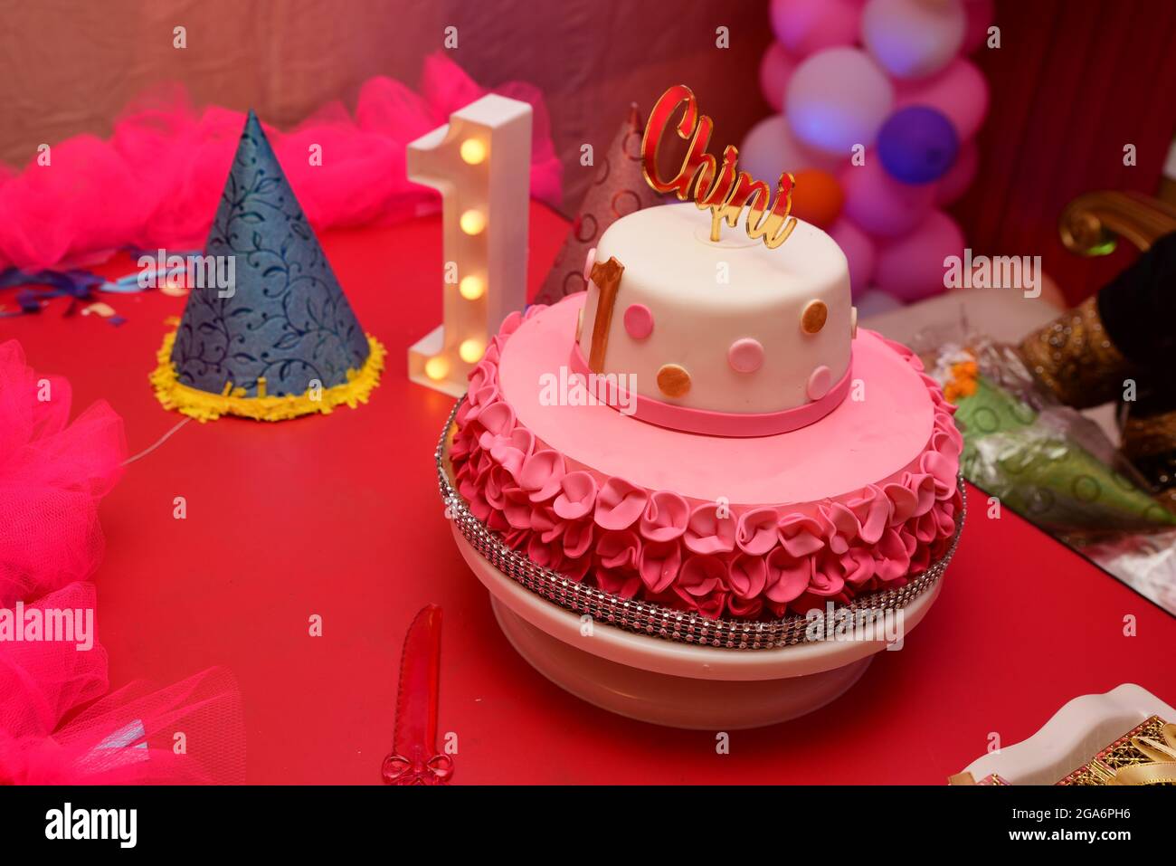 Birthday cake with one candle on pink background Stock Photo Alamy