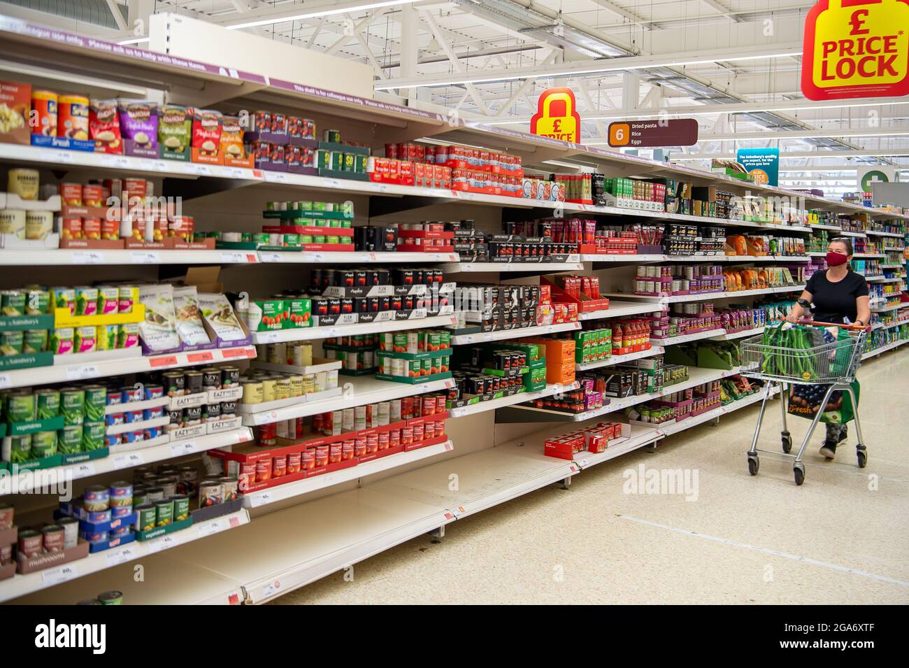 Taplow, Buckinghamshire, UK. 29th July, 2021. Some customers have been panic buying tinned food leaving some gaps in the shelves, however, Sainsbury's Supermarket in Taplow was well stocked this morning. There are some supply chain issues in general with supermarkets due to HGV lorry driver shortages as well as supply chain production staff having to self isolate due to having been pinged by the Covid-19 NHS Track and Trace app. Credit: Maureen McLean/Alamy Live News Stock Photo