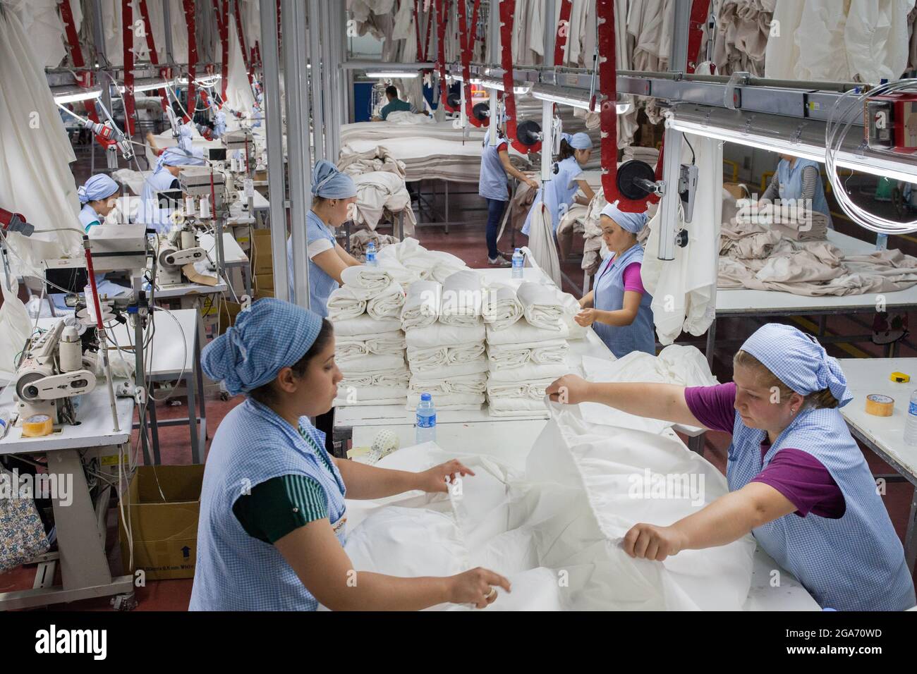 Denizli / Turkey - 06/07/2014: Unknown female workers working in a textile factory. Stock Photo