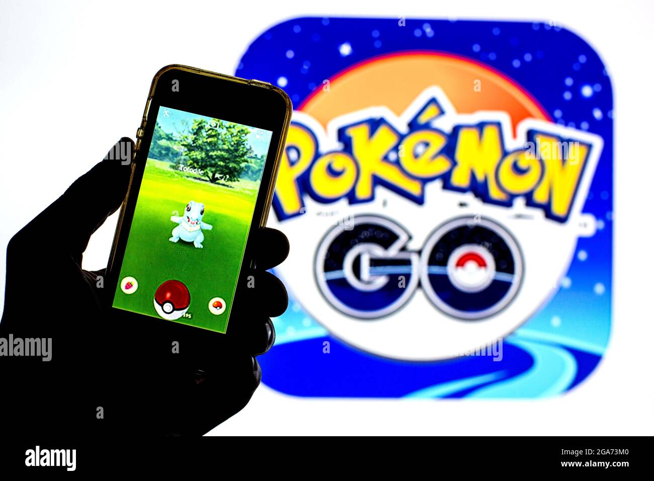 In this photo illustration a Pokémon GO app seen displayed on a smartphone  with a Pokémon GO logo in the background. (Photo by Thiago Prudencio / SOPA  Images/Sipa USA Stock Photo -