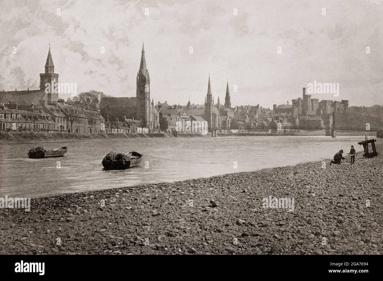 A late 19th century view of Inverness, a city regarded as the capital of the Highlands from the River Ness, historically serving as the county town of the county of Inverness-shire. It is the northernmost city in the United Kingdom and lies within the Great Glen (Gleann Mòr) at its northeastern extremity where the River Ness enters the Beauly Firth. Stock Photo